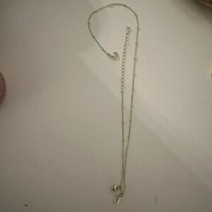 Gold E necklace